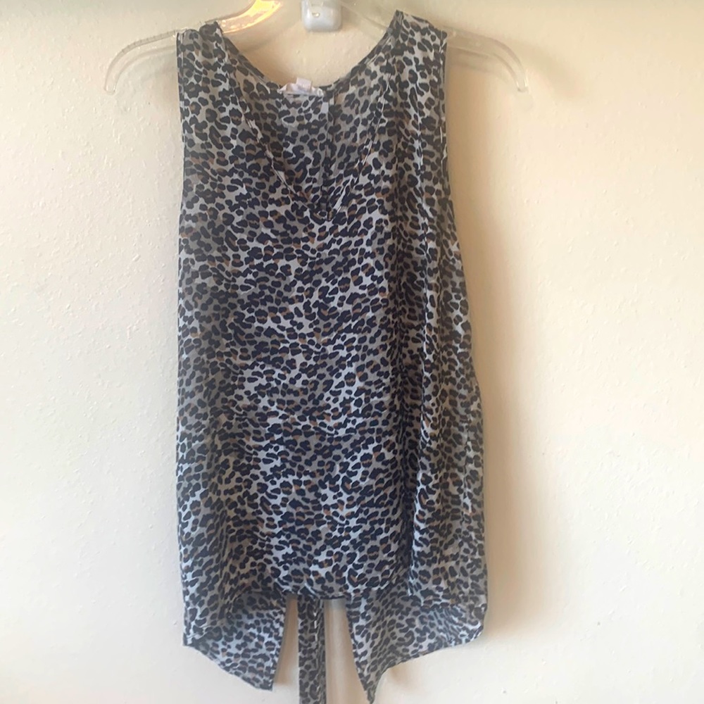 Brand new cheetah print sleeveless blouse. Size m